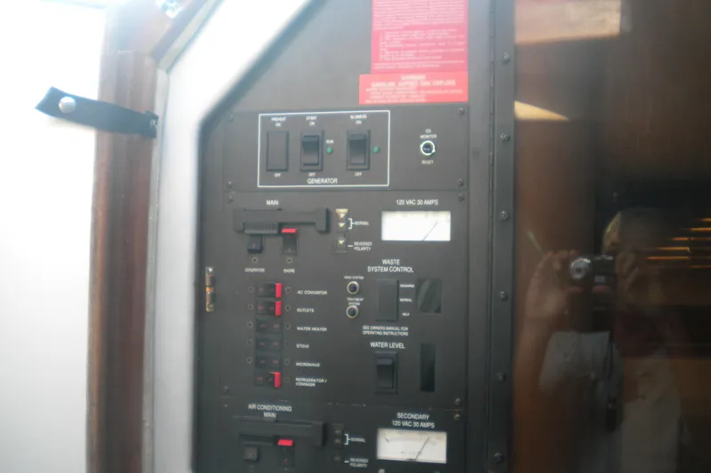 Slide: The Image of Electrical control panel on a 1990 Sea Ray 310 Sundancer boat. - 21