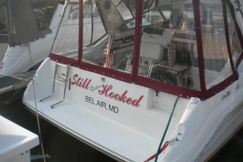 Slide: The Image of 1990 Sea Ray 310 Sundancer boat named "Still Hooked" docked in Bel Air, MD. - 3