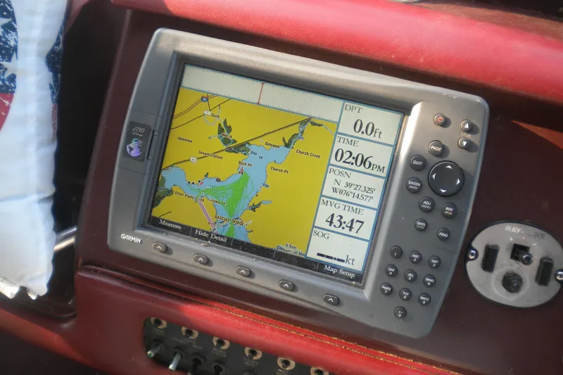 Slide: The Image of Garmin GPS navigation system on 1990 Sea Ray 310 Sundancer boat dashboard. - 9