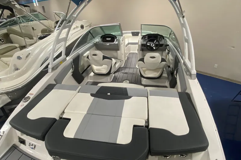 Slide: The Image of 2023 Chaparral 21 SSi boat interior with sleek seating and modern design. - 2