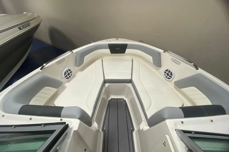Slide: The Image of 2023 Chaparral 21 SSi boat interior with cushioned seating and speakers. - 3