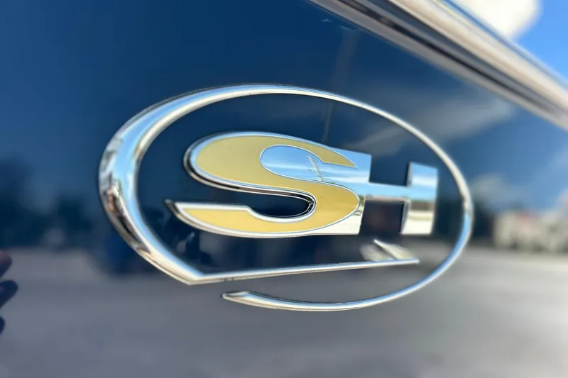 Slide: The Image of Close-up of Sea Hunt Gamefish 27 logo on 2019 boat exterior. - 13