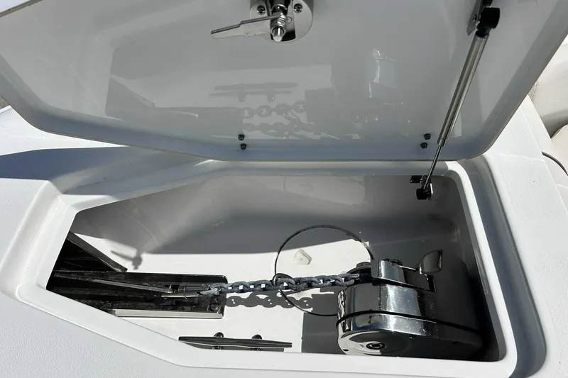 Slide: The Image of Open anchor locker on 2019 Sea Hunt Gamefish 27 Forward Seating boat. - 29