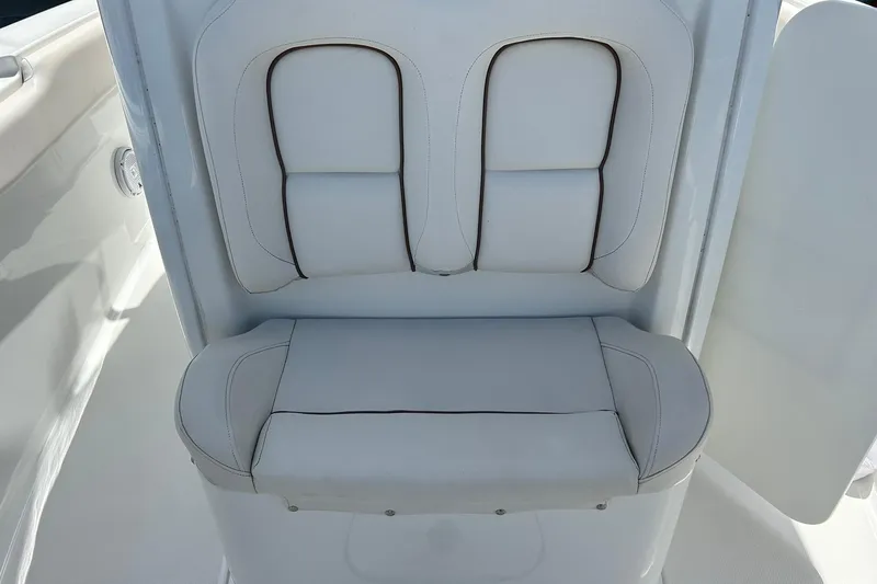 Slide: The Image of 2019 Sea Hunt Gamefish 27 Forward Seating, featuring white cushioned boat seat. - 30