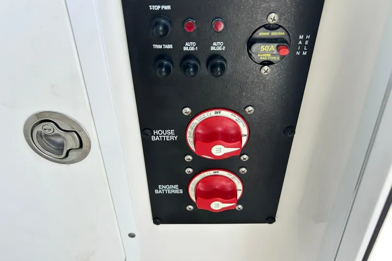 Slide: The Image of Control panel of a 2019 Sea Hunt Gamefish 27 boat with battery switches. - 32