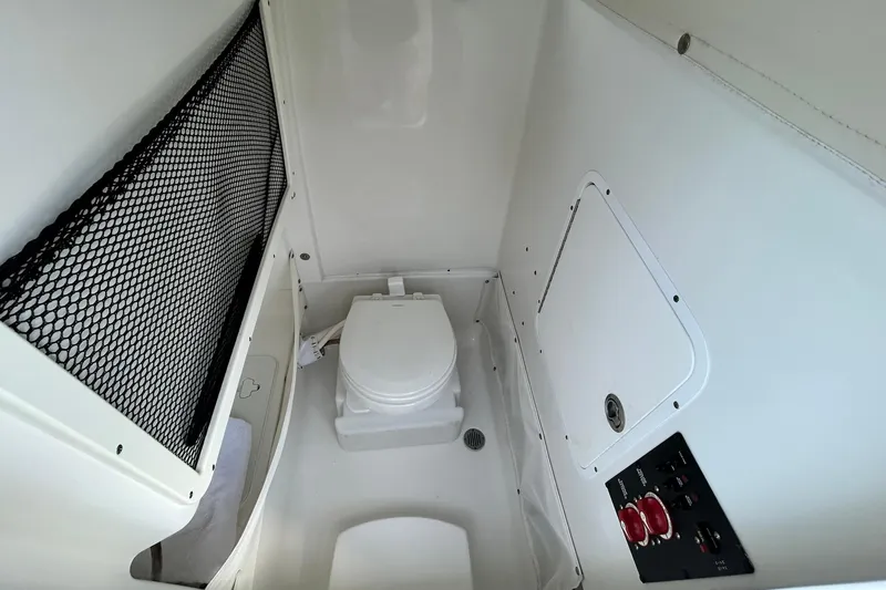 Slide: The Image of Interior of 2019 Sea Hunt Gamefish 27 boat with compact marine toilet. - 33