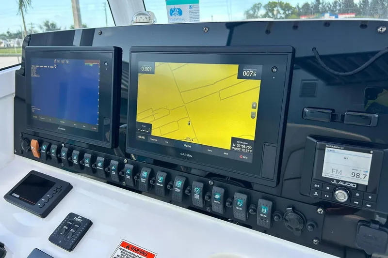 Slide: The Image of Control panel of 2019 Sea Hunt Gamefish 27 with Garmin navigation displays. - 36