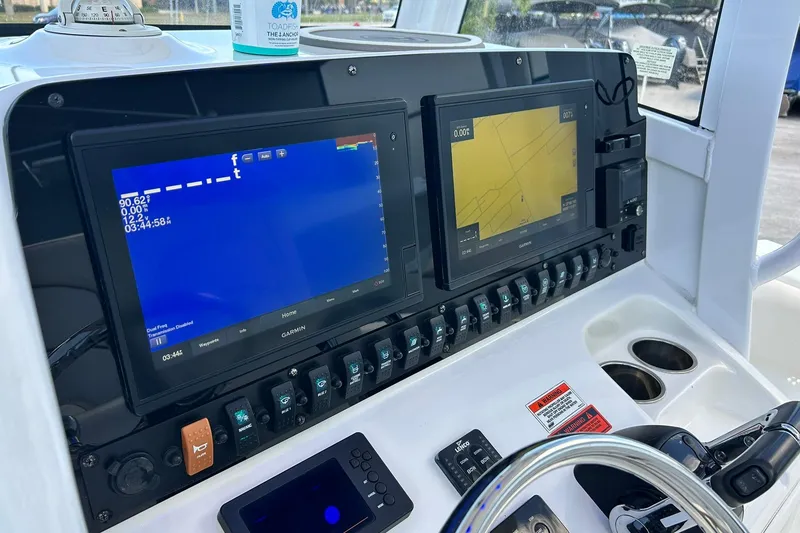 Slide: The Image of Control panel of 2019 Sea Hunt Gamefish 27 with dual Garmin displays. - 37