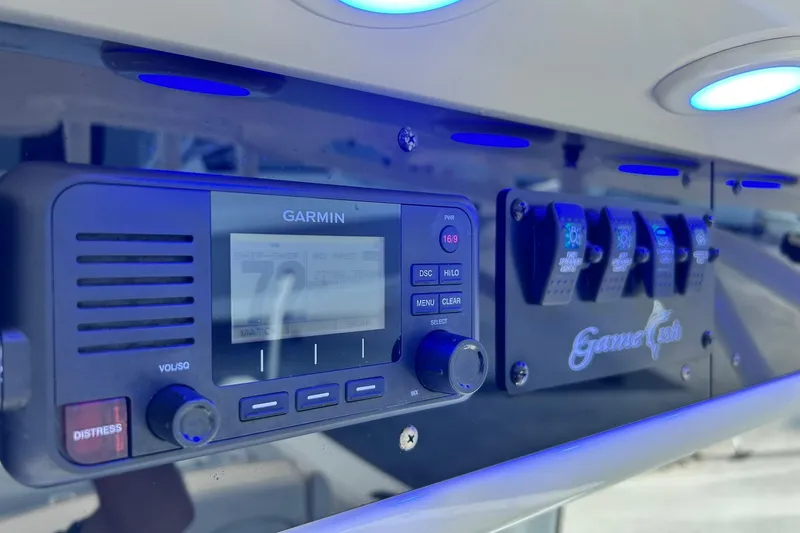 Slide: The Image of Control panel of 2019 Sea Hunt Gamefish 27 with Garmin display and blue lighting. - 39