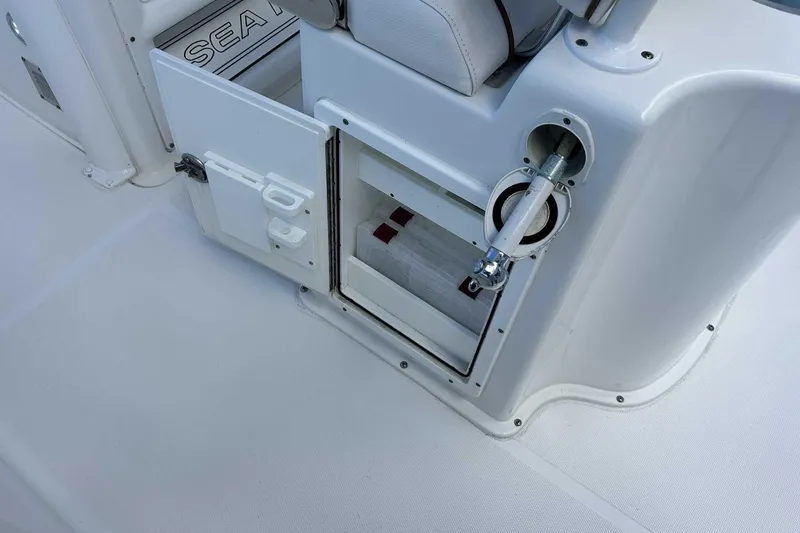 Slide: The Image of 2019 Sea Hunt Gamefish 27 Forward Seating boat storage compartment open. - 49