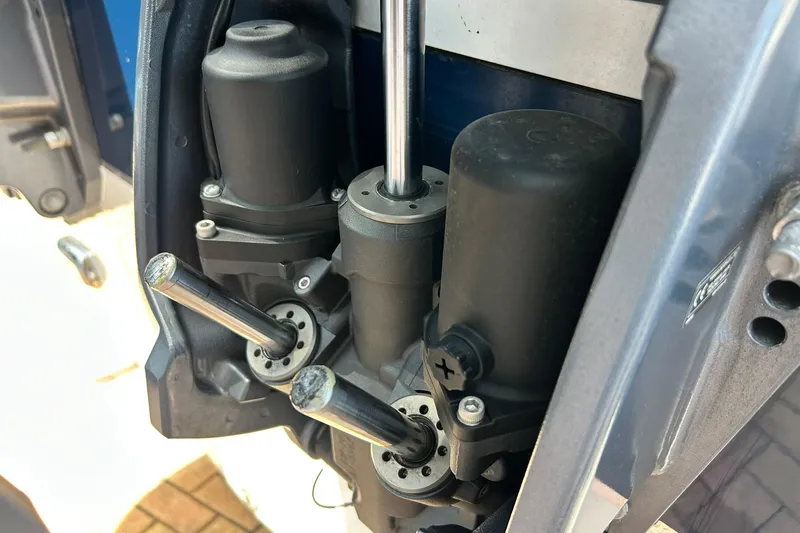 Slide: The Image of Close-up of 2019 Sea Hunt Gamefish 27 engine components, showcasing mechanical details. - 9