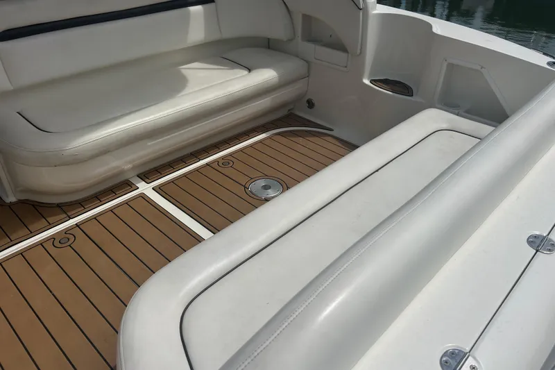 Slide: The Image of 2005 Sea Ray 360 Sundancer interior with white seating and teak flooring. - 12