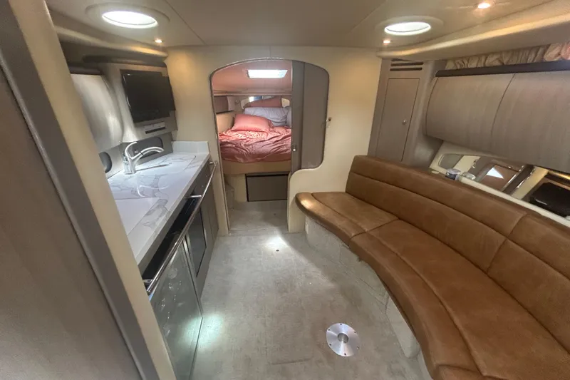 Slide: The Image of Interior of 2005 Sea Ray 360 Sundancer yacht with kitchen, seating, and bedroom. - 27