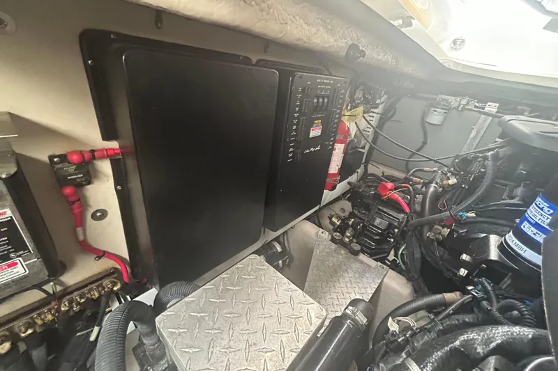 Slide: The Image of Engine compartment of a 2005 Sea Ray 360 Sundancer with electrical panel and components. - 45