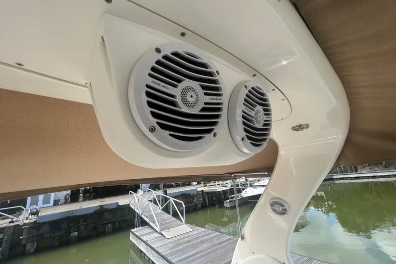 Slide: The Image of Marine speakers on a 2005 Sea Ray 360 Sundancer boat, docked by the water. - 46