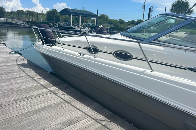 Slide: The Image of 2005 Sea Ray 360 Sundancer docked at a marina on a sunny day. - 6