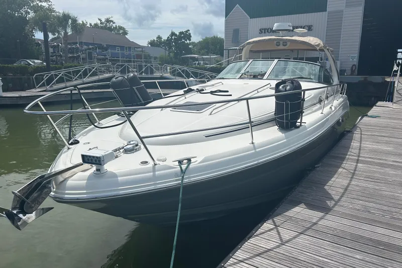 Slide: The Image of 2005 Sea Ray 360 Sundancer docked at marina, showcasing sleek design and modern features. - 7