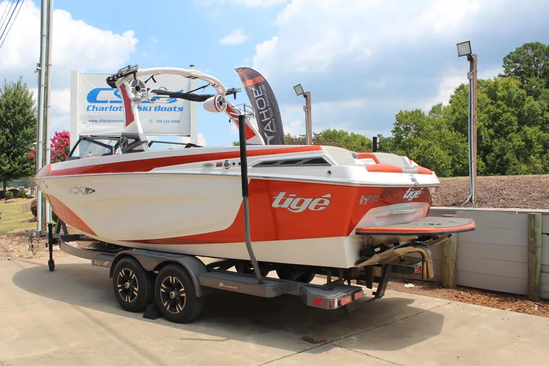 Slide: The Image of 2020 Tigé 23ZX boat on trailer, displayed outdoors at Charlotte Ski Boats dealership. - 3