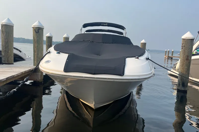 Slide: The Image of 2013 Sea Ray 280 Sundeck boat docked at marina, covered and secured. - 1