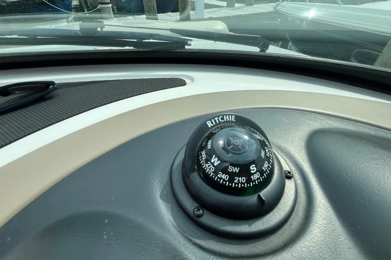 Slide: The Image of Compass on 2013 Sea Ray 280 Sundeck dashboard, showing navigation details. - 23