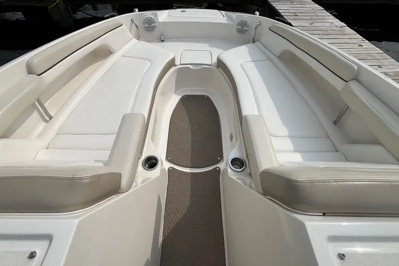 Slide: The Image of 2013 Sea Ray 280 Sundeck interior with spacious seating and cup holders. - 28