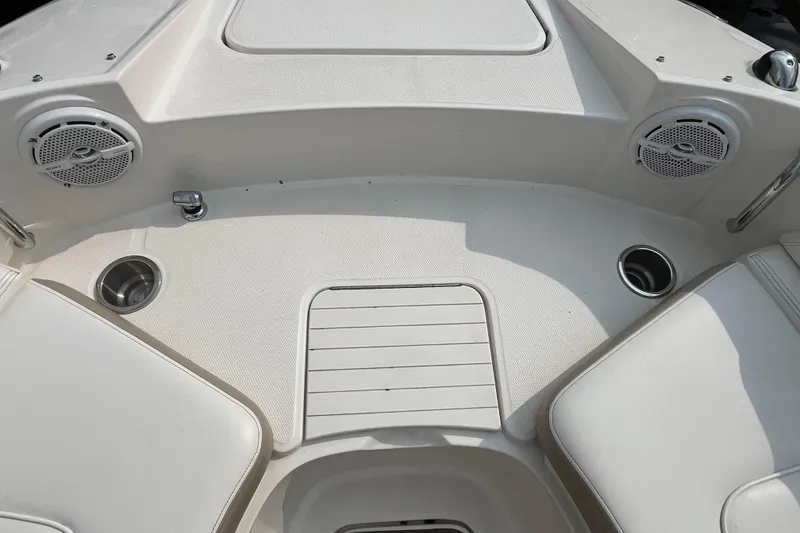 Slide: The Image of 2013 Sea Ray 280 Sundeck boat interior with speakers and cup holders. - 32