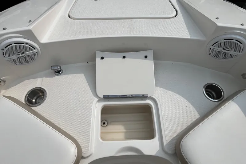 Slide: The Image of 2013 Sea Ray 280 Sundeck boat interior with speakers and cup holders. - 33