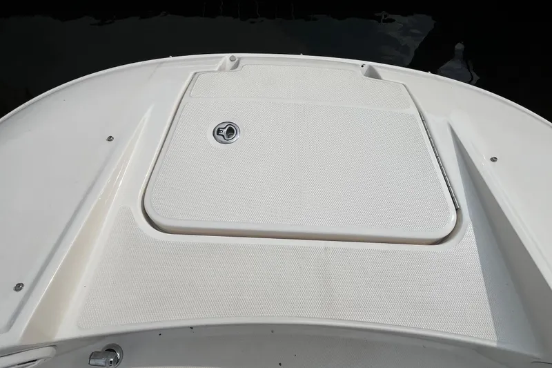 Slide: The Image of 2013 Sea Ray 280 Sundeck boat deck with storage compartment. - 34