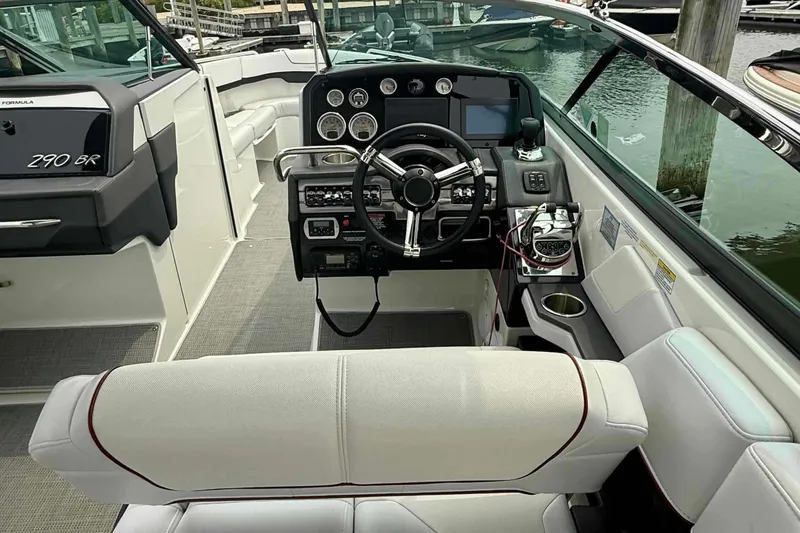 Slide: The Image of 2020 Formula 290 Bowrider cockpit with steering wheel, dashboard, and seating. - 14