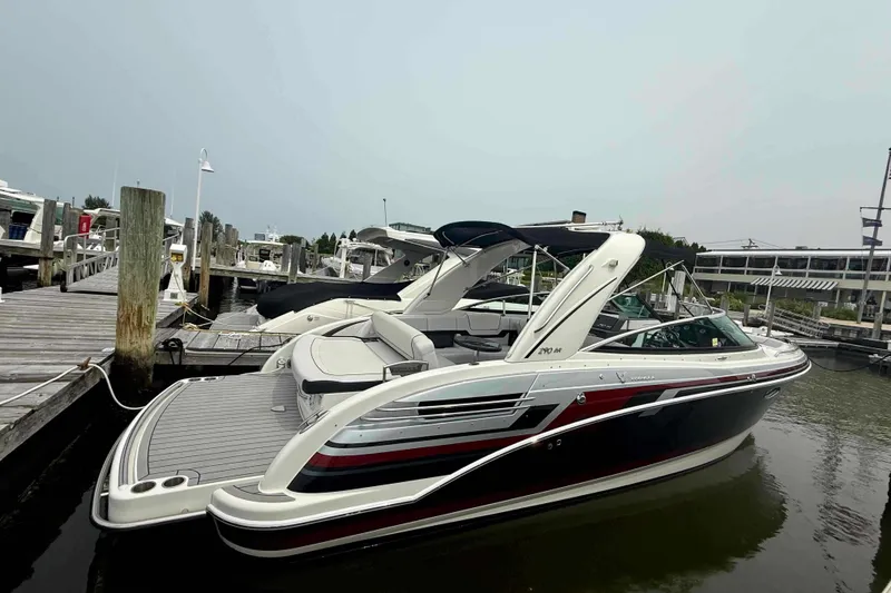 Slide: The Image of 2020 Formula 290 Bowrider docked at marina, showcasing sleek design and spacious seating. - 2