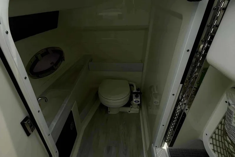 Slide: The Image of Interior of 2020 Formula 290 Bowrider boat bathroom with toilet and sink. - 25