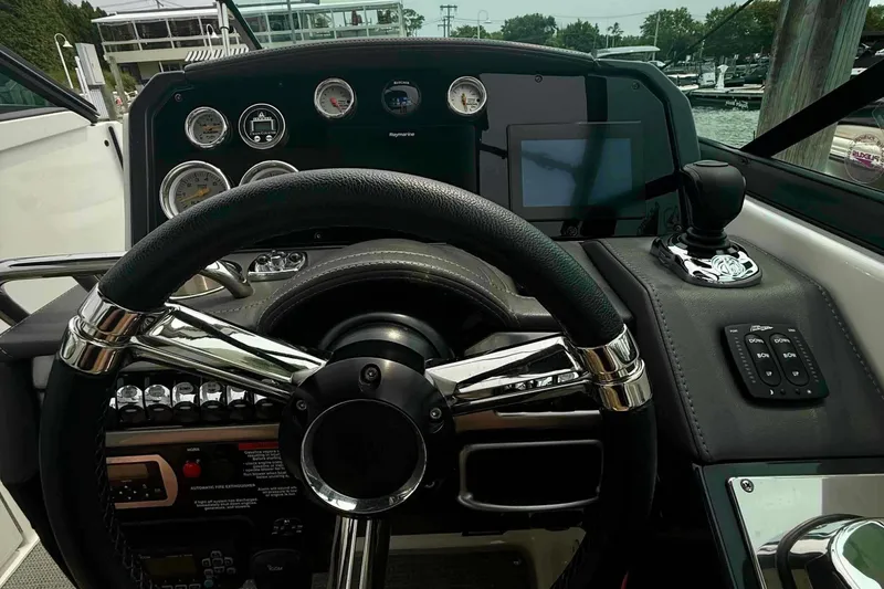 Slide: The Image of Steering console of a 2020 Formula 290 Bowrider boat with gauges and controls. - 29
