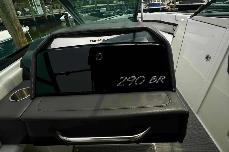 Slide: The Image of 2020 Formula 290 Bowrider dashboard with sleek design and cup holder. - 35
