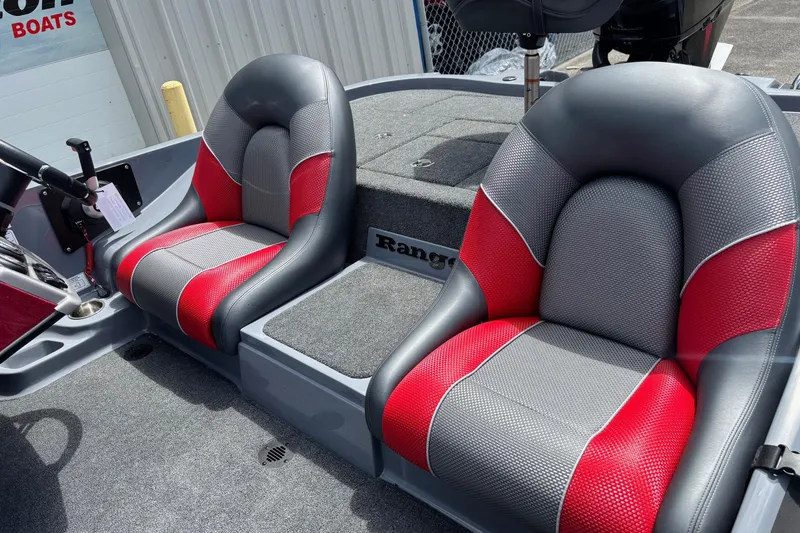 Slide: The Image of 2026 Ranger Z185 boat interior with red and gray seats, steering wheel visible. - 10