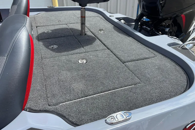 Slide: The Image of 2026 Ranger Z185 boat deck with gray carpet and seating. - 13