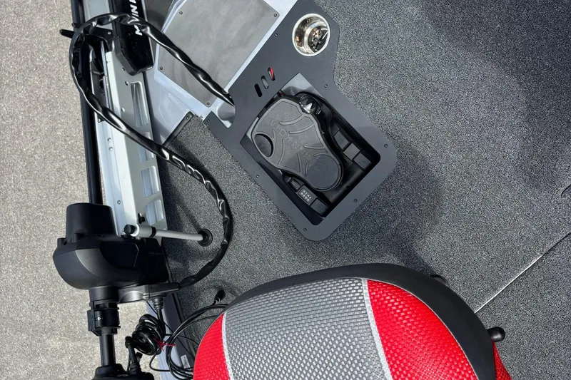 Slide: The Image of 2026 Ranger Z185 boat interior with foot pedal and red-gray seat. - 4