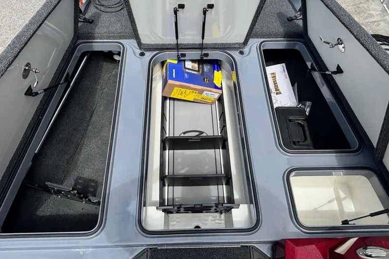 Slide: The Image of 2026 Ranger Z185 boat storage compartments with open lids and organized interior. - 6