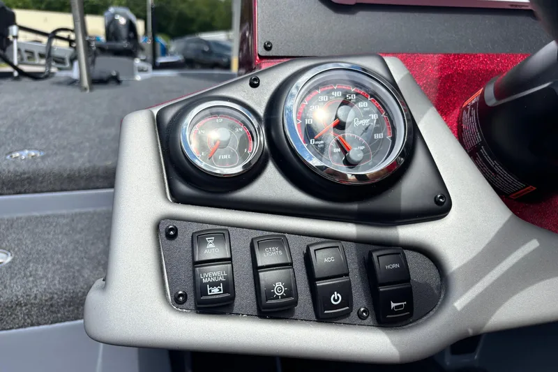 Slide: The Image of Dashboard controls and gauges of a 2026 Ranger Z185 boat, featuring speedometer and fuel gauge. - 8