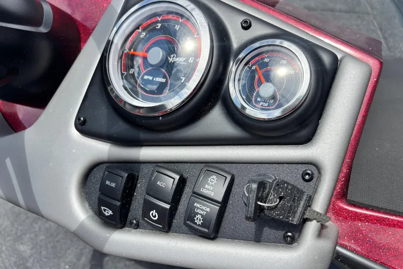 Slide: The Image of Dashboard of 2026 Ranger Z185 boat with gauges and control switches. - 9