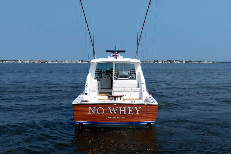 Slide: The Image of 2023 Henriques 42 Express Hardtop boat named "No Whey" on open water. - 13
