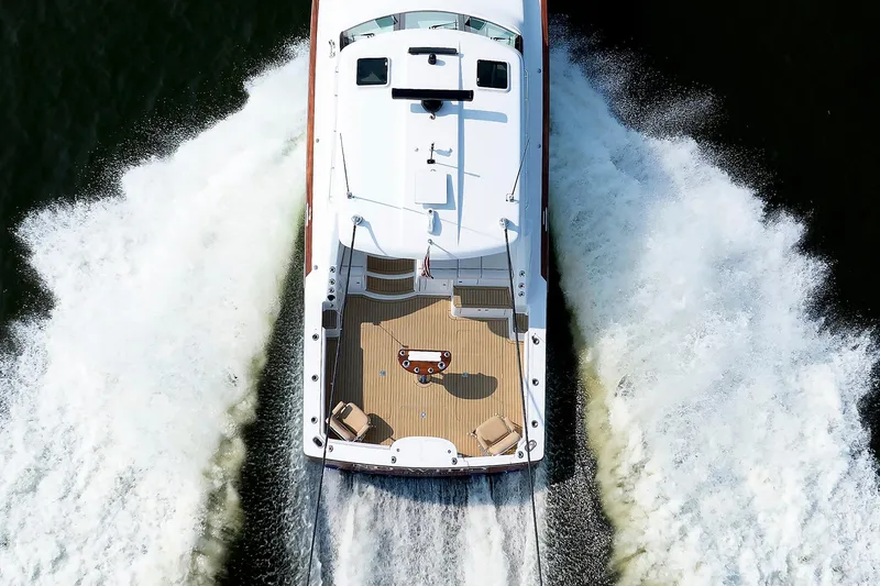 Slide: The Image of Aerial view of 2023 Henriques 42 Express Hardtop yacht cruising on water. - 15