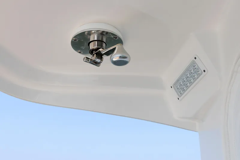 Slide: The Image of 2023 Henriques 42 Express Hardtop interior detail with light fixture and handle. - 27