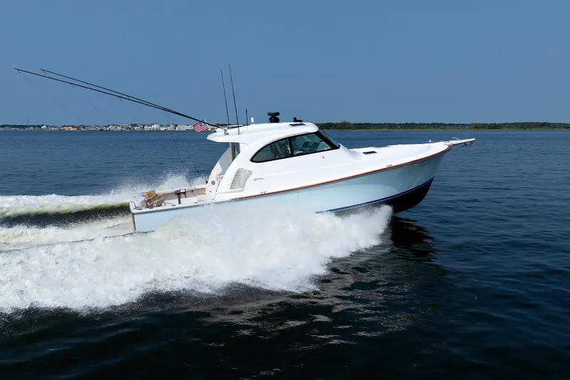 Slide: The Image of 2023 Henriques 42 Express Hardtop cruising on open water, showcasing sleek design and performance. - 3