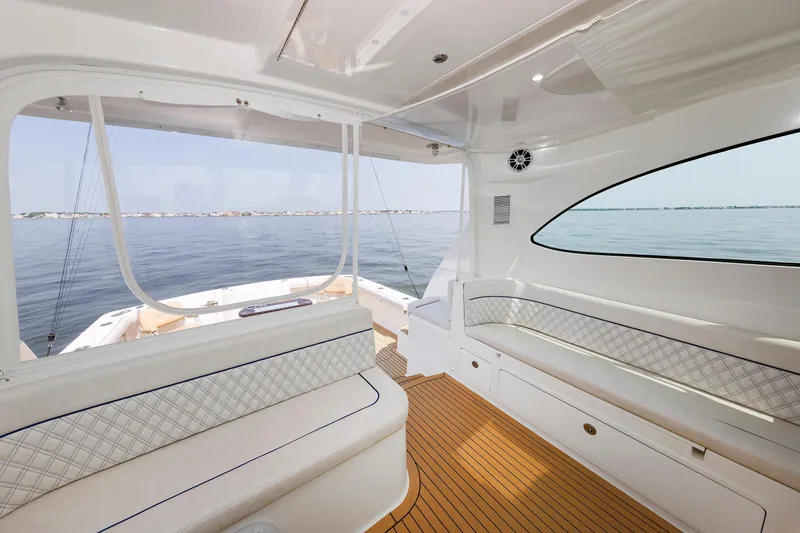 Slide: The Image of Interior view of 2023 Henriques 42 Express Hardtop yacht with ocean backdrop. - 33