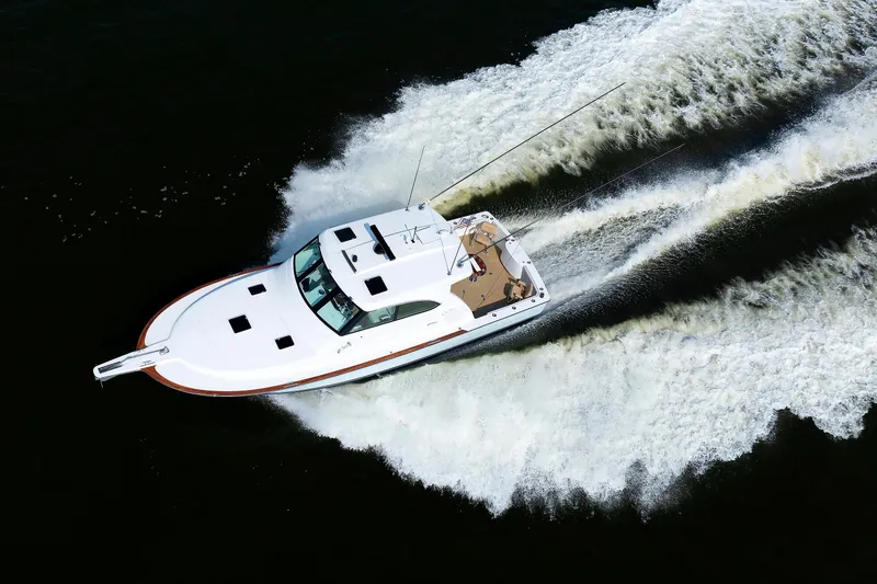 Slide: The Image of 2023 Henriques 42 Express Hardtop cruising on water, aerial view. - 5