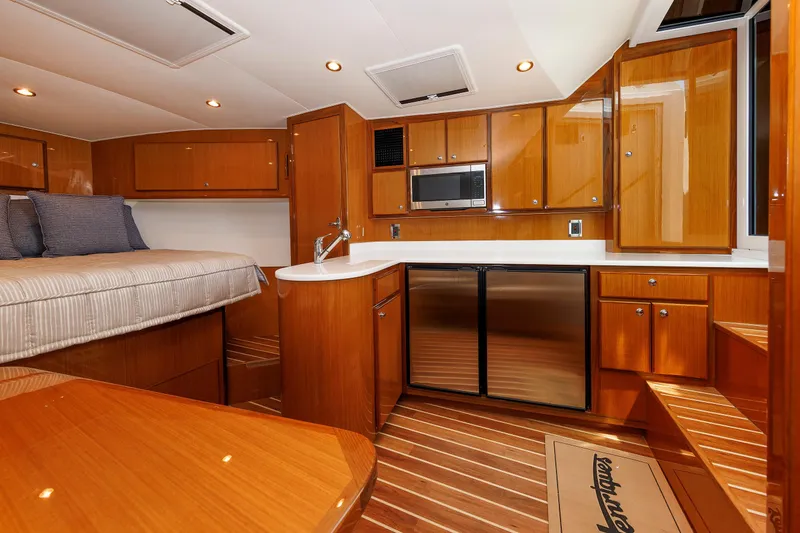 Slide: The Image of Luxurious interior of 2023 Henriques 42 Express Hardtop yacht with wood finish and modern amenities. - 51