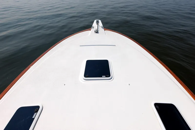Slide: The Image of Bow view of 2023 Henriques 42 Express Hardtop on calm water. - 57