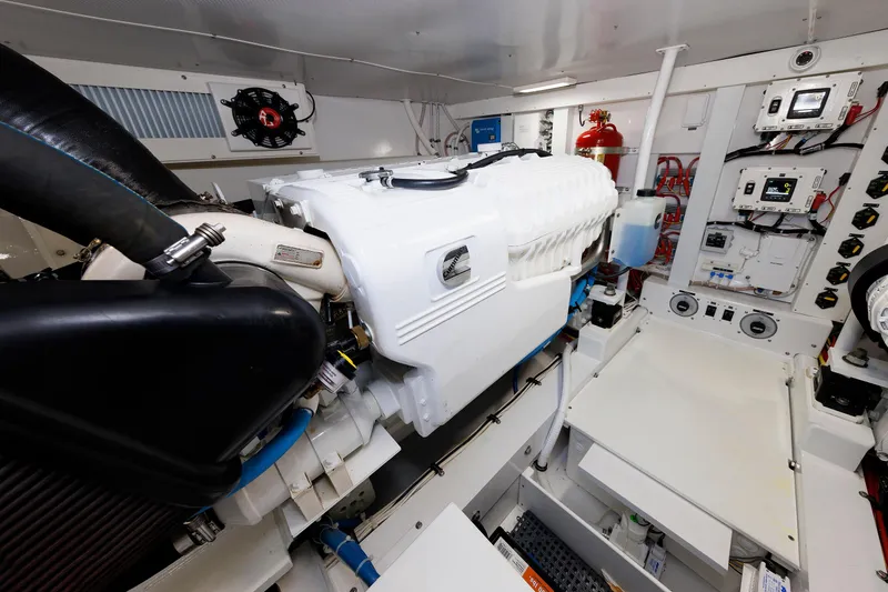 Slide: The Image of Engine room of 2023 Henriques 42 Express Hardtop, showcasing advanced marine equipment and controls. - 63