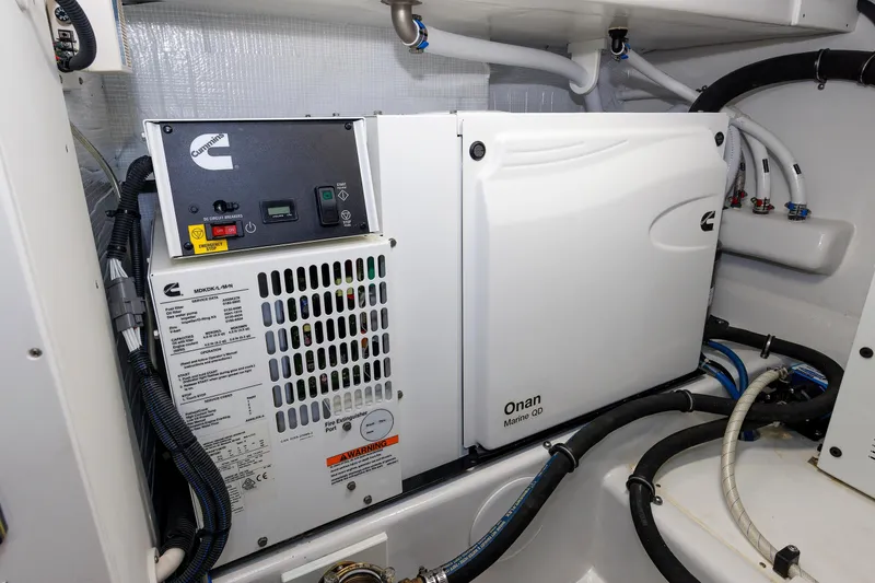 Slide: The Image of Cummins Onan Marine QD generator in 2023 Henriques 42 Express Hardtop engine room. - 66