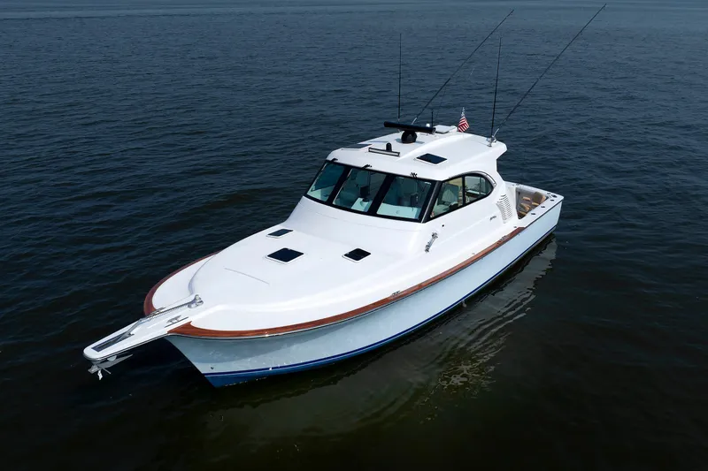 Slide: The Image of 2023 Henriques 42 Express Hardtop boat on calm water, aerial view. - 8